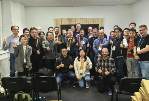 Group photo of speakers and participants in the event