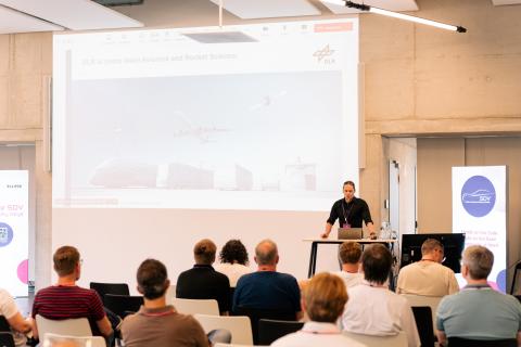 Man giving a presentation in front of an audience