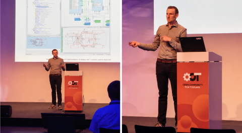 Heiko Klare presenting at Open Community for Tooling, standing at a podium with a laptop, with slides behind showing software modelling diagrams and engineering tools.